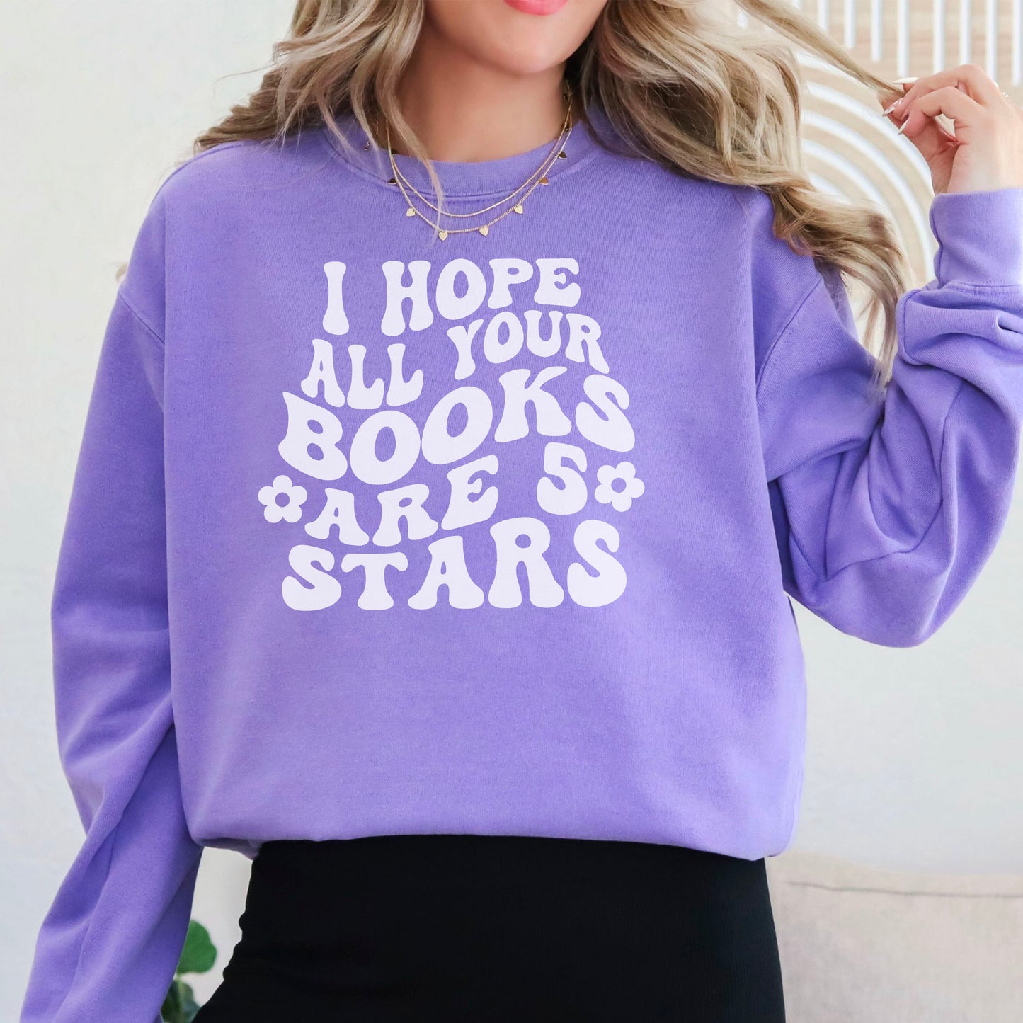 Cozy bookish sweatshirt featuring a bold, retro-style "I Hope All Your Books Are 5 Stars" design. Modeled in various colors, this soft and stylish sweater is perfect for book lovers who enjoy comfy, literary-inspired fashion while reading or lounging.